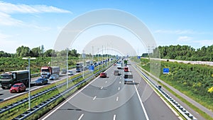 Modern dutch deepened highway A4, afternoon traffic jam direction Rotterdam, Netherlands