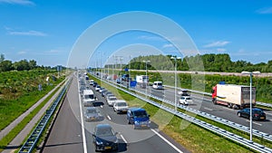 Modern dutch deepened highway A4, afternoon traffic jam direction Rotterdam, Netherlands