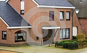 Modern dutch house in vintage style, luxurious home exterior, bungalow in a small village in the Netherlands