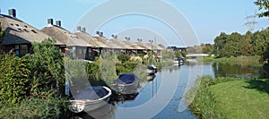 Modern Dutch houses in Holland on the waterside photo