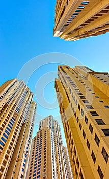 Modern dwelling houses against the blue sky