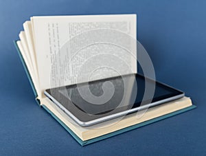 Modern ebook reader in traditional book
