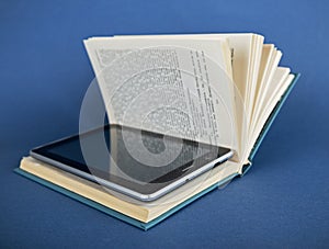 Modern ebook reader in traditional book