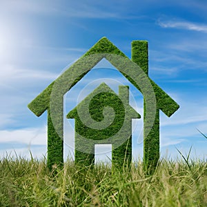 Modern eco house on grass, blue sky backdrop, represents sustainability and harmony with nature.