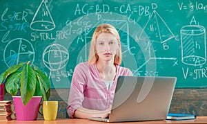Modern education. Back to school. Remote education. Student adorable blonde girl classroom chalkboard background. STEM