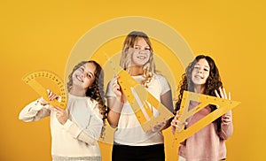 Modern education concept. sisterhood. three girls with protractor and triangle ruler. back to school. STEM school