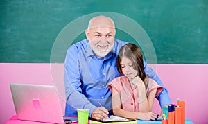 Modern education. Happy student. Student girl with teacher man at blackboard. Schoolgirl and tutor with laptop. Senior