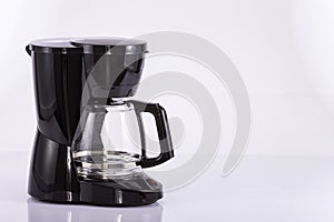 Modern electric coffee maker on white background