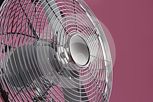 Modern electric fan on pink background  closeup