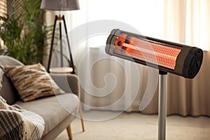 Modern electric infrared heater at home