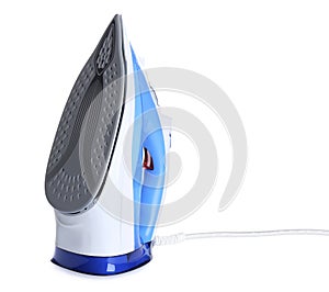 Modern electric iron on white. Household appliance