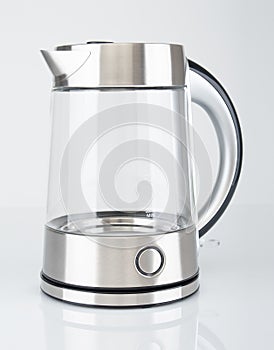 Modern electric kettle close up on gray background