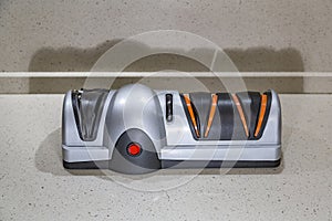 Modern electric knife sharpener in the home kitchen