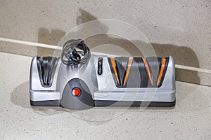 Modern electric knife sharpener in the home kitchen