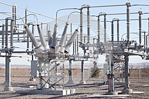 A modern electrical substation with transformers and insulators..