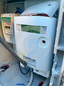 Modern electricity meter outside the house