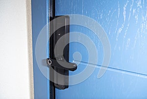 Modern electronic reliable door lock using an access password and a card. High burglary protection. Copy space for text