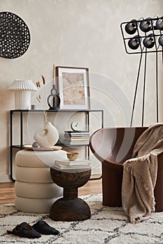 Modern elegant living room interior design with creative armchair, console, mock up poster frame, lamp and stylish personal.