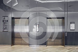 Modern elevator with closed doors in lobby