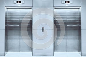 Modern elevator with closed doors in lobby