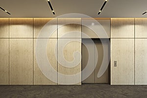 Modern elevator with closed doors in office lobby