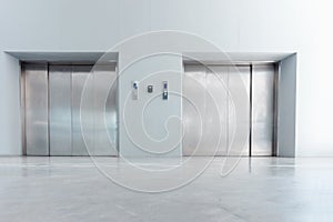 Modern Elevator and Interior Decoration of Lobby Entrance Flooring, Steel Door Accessibility Gate Elevator of Office Building.