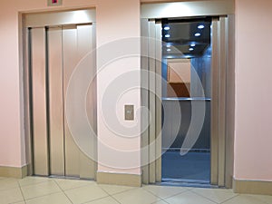 Modern elevator with opened and closed doors