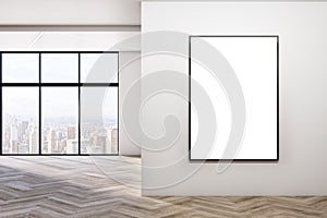 Modern empty concrete room interior with blank mock up poster on wall, windows, city view, sunlight, wooden flooring and shadows.