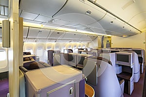 Modern empty Interior in the airplane or passenger plane while parking view from rear