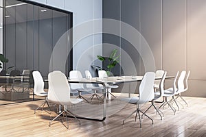 A modern and empty meeting room with a large table, white chairs, and glass partition, on a wooden floor background, concept of a