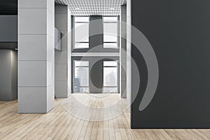 Modern empty office interior with empty mock up place on concrete wall, wooden flooring and windows and city view.