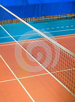 Modern empty school gym indoor with volleyball net, vertical frame