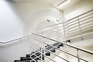 Modern empty staircase with white wall.