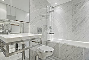 Modern en suite marble bathroom in white photo
