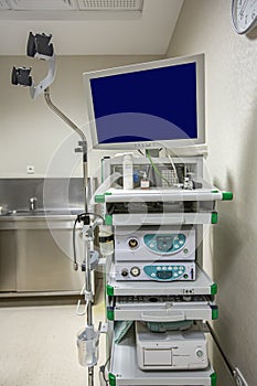 Modern endoscopy equipment kit. Electronic video Endoscopy System. A patients couch and a stand with a gastroscope and a monitor