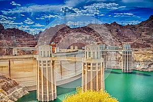 Modern Energetics Ideas. Hoover Dam With Penstock Towers in Lake Mead of the Colorado River on Border of Arizona and Nevada