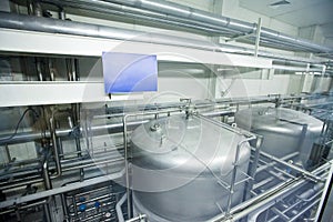 Modern energy-efficient beer filtration line interior. Factry vats, pipeline, valves of beer production