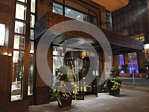 Modern entrance to an apartment building in the trendy neighbourhood of Yorkville in Toronto at night