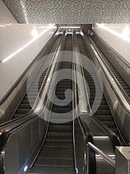 A modern escalator at a metro station in Minsk. Climbing stairs