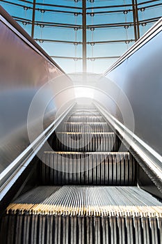 Modern escalator with window at the background. photo
