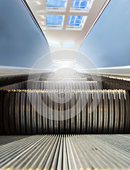 Modern escalator with window at the background. photo