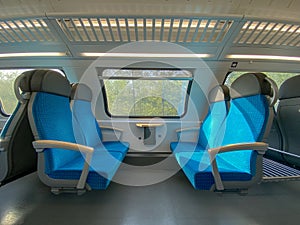 Modern european economy class fast train interior.