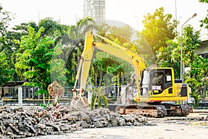 Modern excavator performs excavation work on the construction site