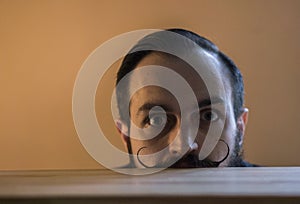 Modern, Expressive Bearded Office Clerk with Mustages Working with Notebook at Office