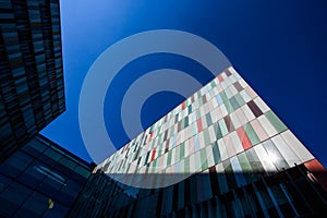 Modern exterior of a colorful office building in Milan, Italy