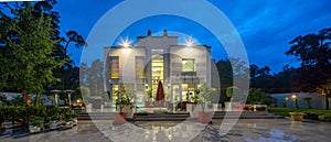 Modern exterior of luxury private house at twilight. View of entrance.