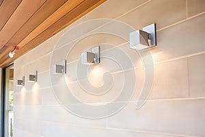 modern exterior recessed downlights on concrete wall