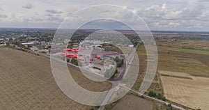 Modern factory top view, flying around a new modern factory in orange colors. Industrial exterior of a modern factory