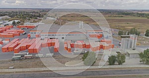 Modern factory top view, flying around a new modern factory in orange colors. Industrial exterior of a modern factory