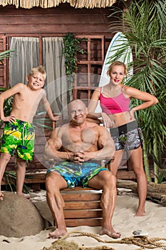 A modern family of three on a sandy beach with a